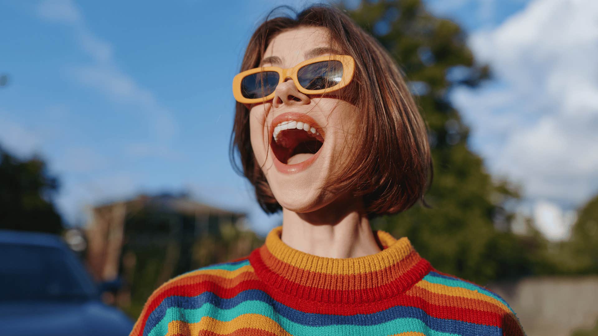 confident woman who is with the right man laughing outside