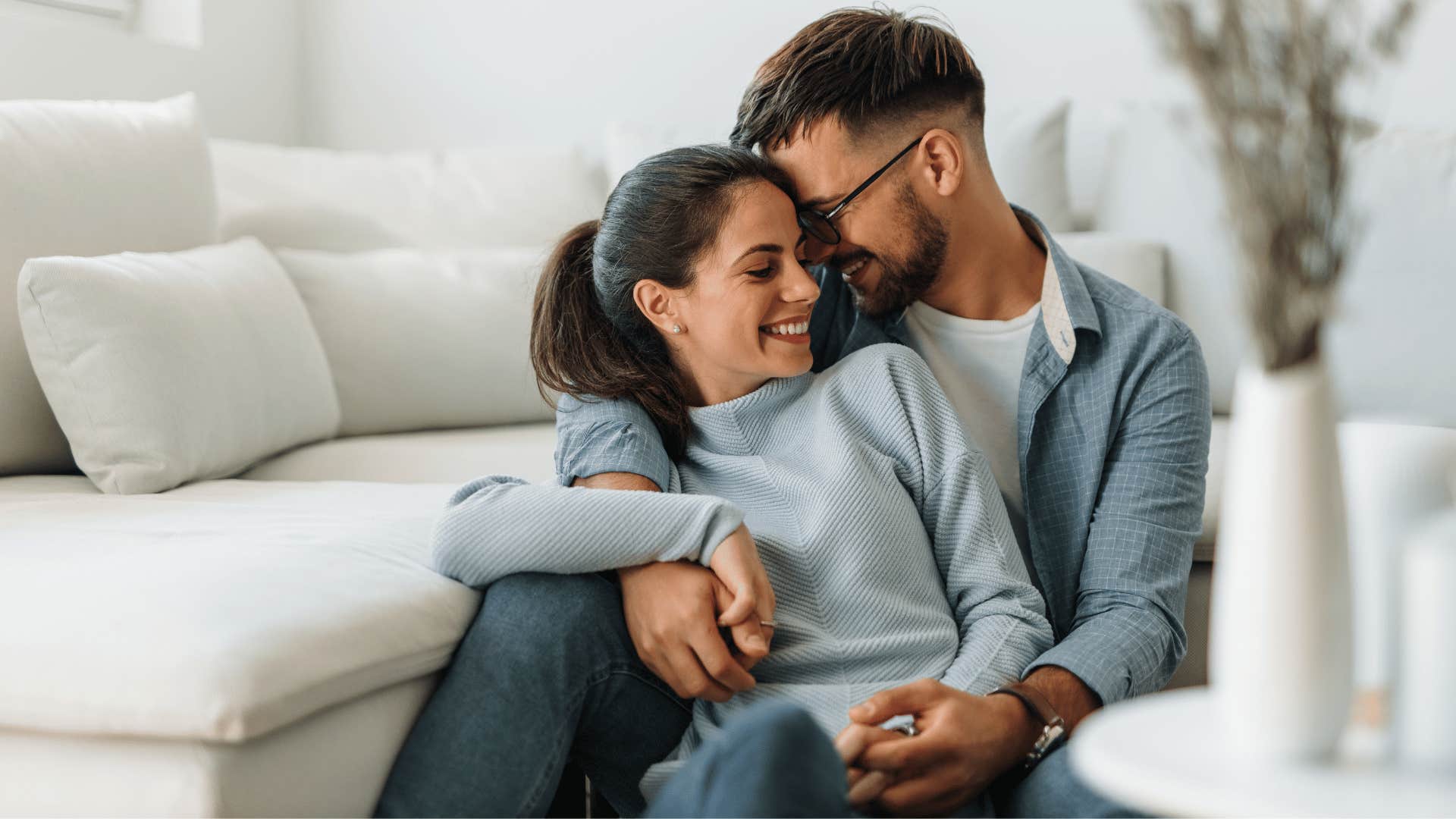 couple hugging woman being naturally affectionate