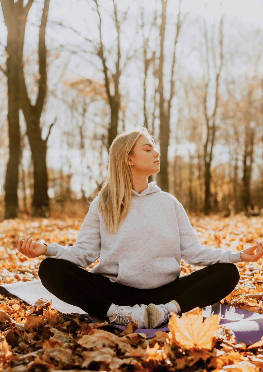 woman meditating outdoors