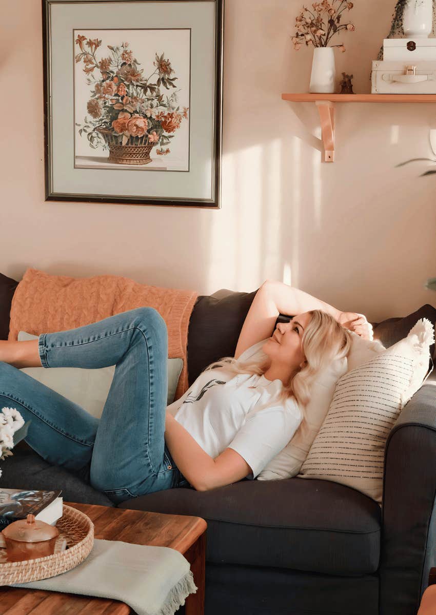 woman relaxing on a couch alone