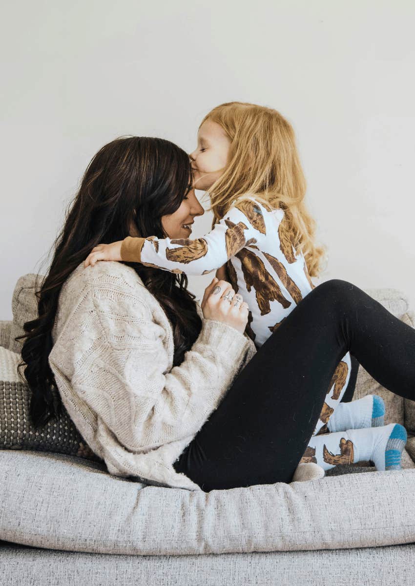 woman teaching girl to be kind but not weak
