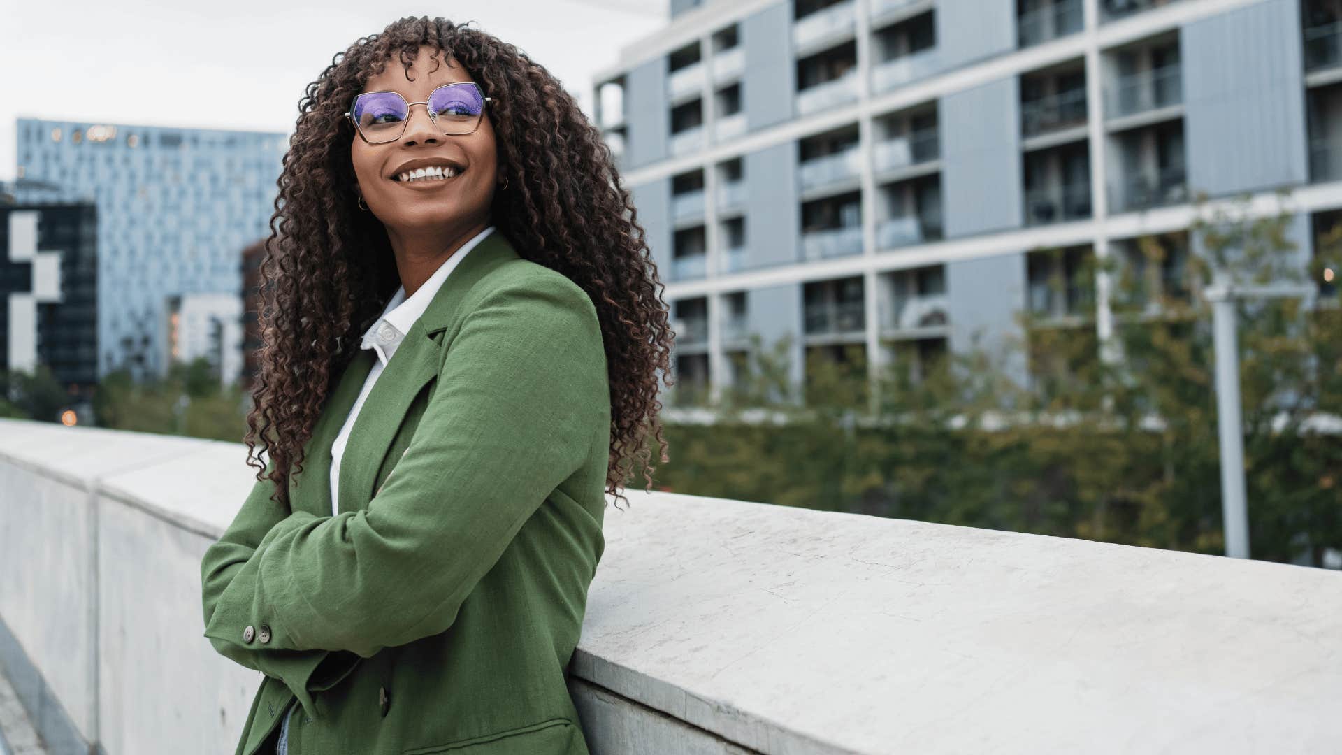 self-reliant woman standing outside feeling free