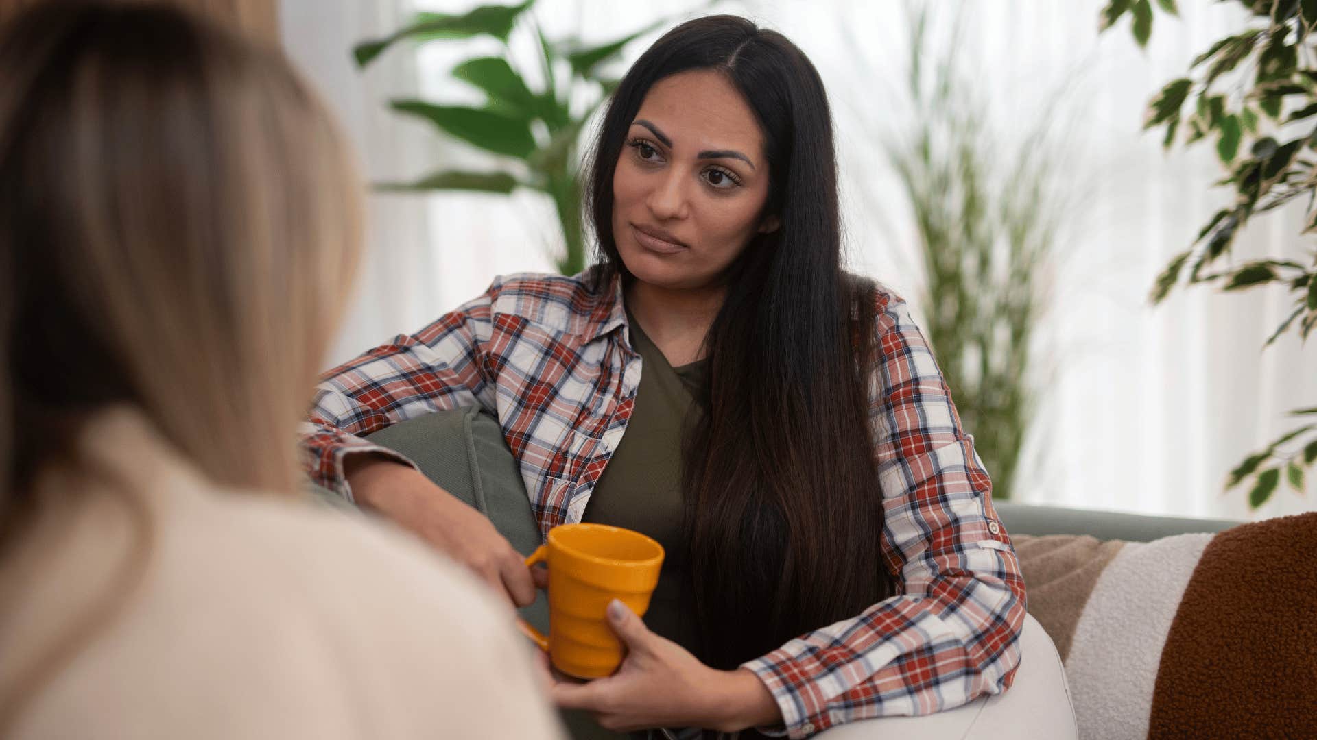 woman talking to friend refusing to be a people-pleaser