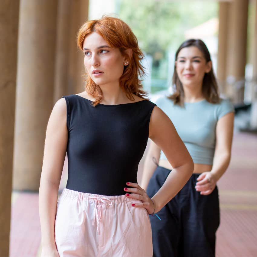 Confident woman walking away from an unproductive conversation after maintaining her composure
