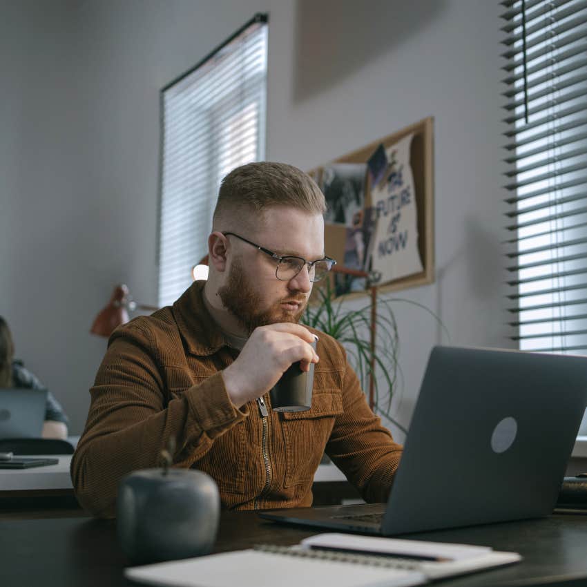 man doing some research on his computer 