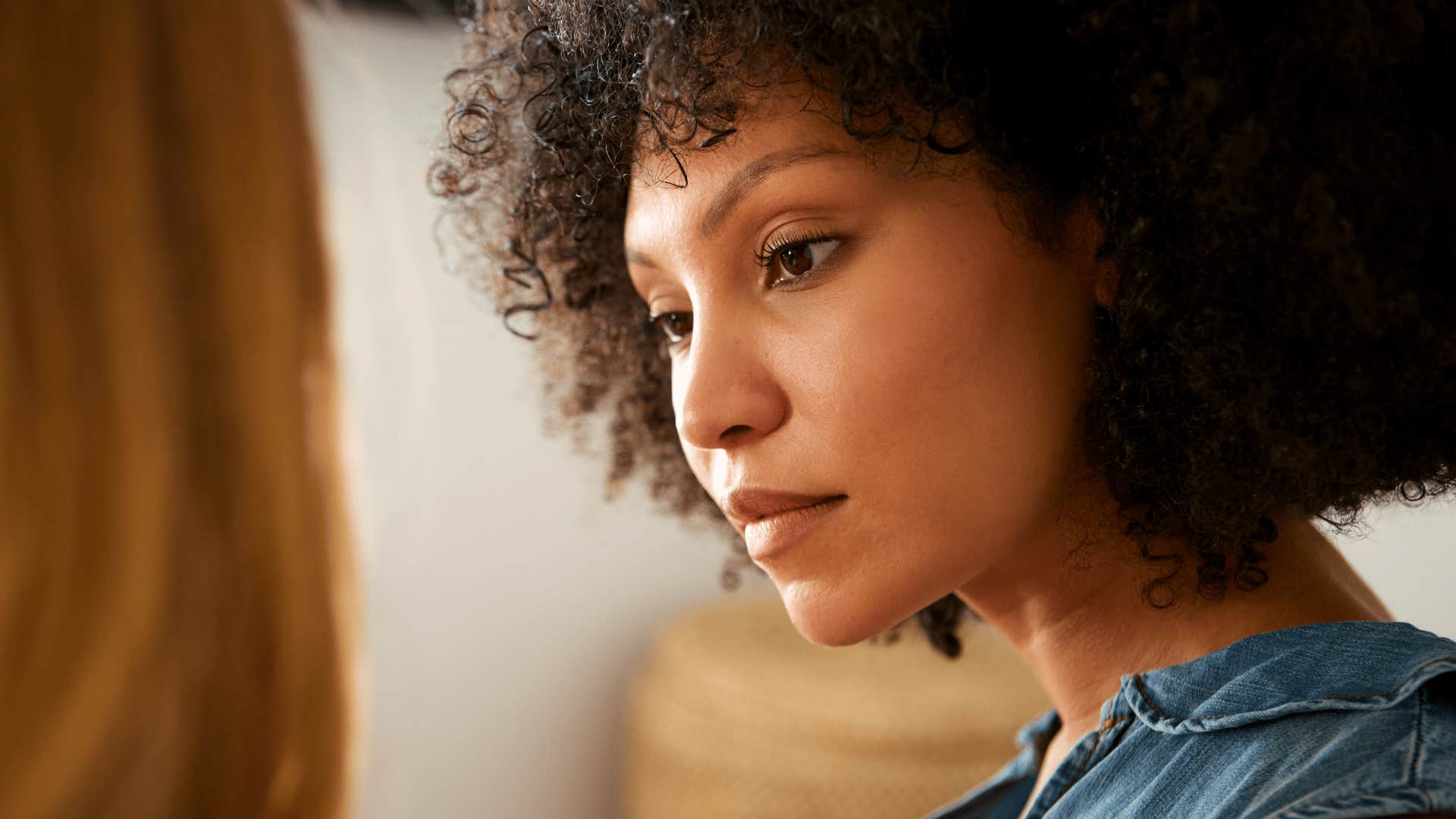 assertive woman telling friend she's annoyed at that she forgives her