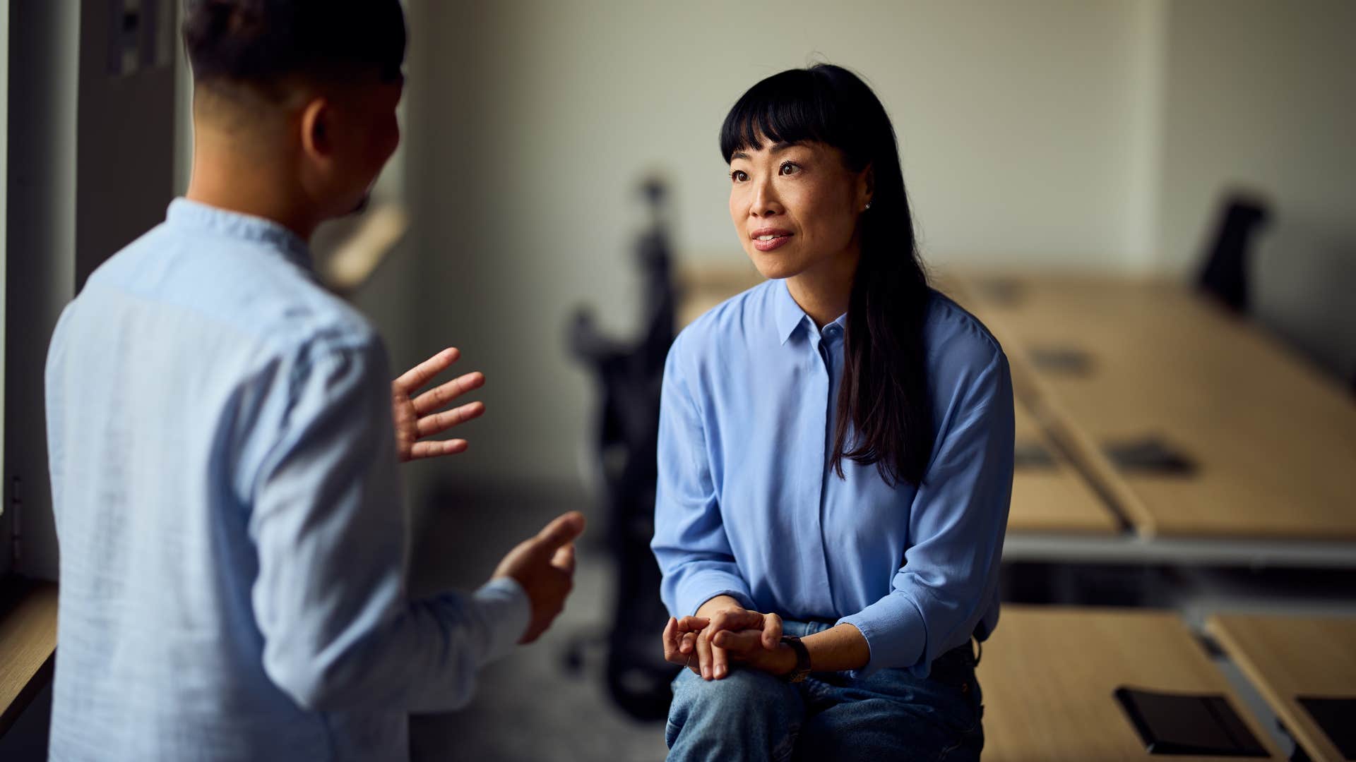 assertive confident woman telling annoying man she doesnt care what he thinks