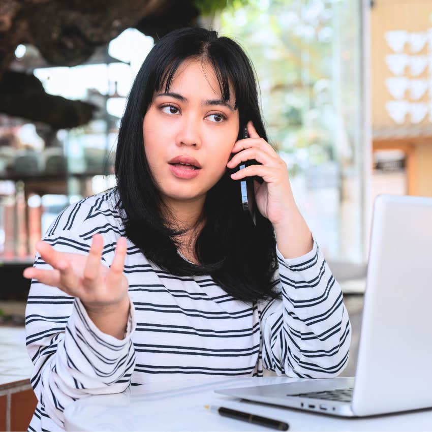 Woman saying "at least he doesn't" on the phone.