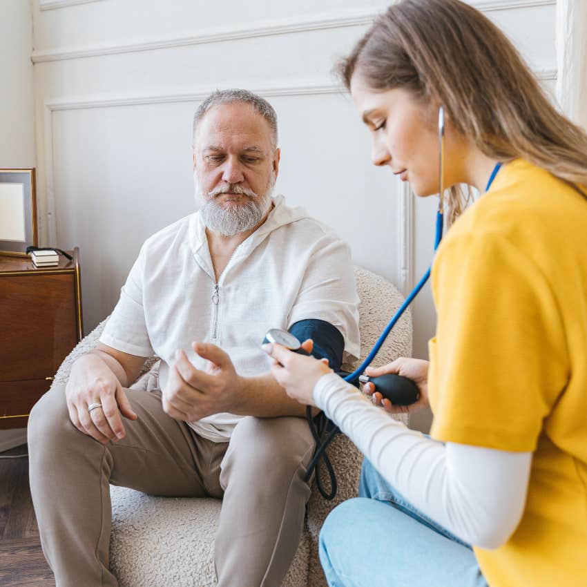 older man getting his blood pressure checked