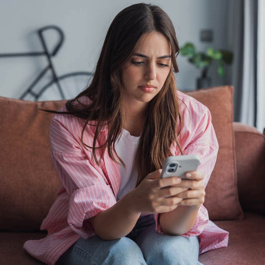 intelligent woman uninstalling dating apps on her phone