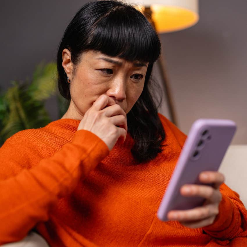 woman with a desire for popularity looking at her phone