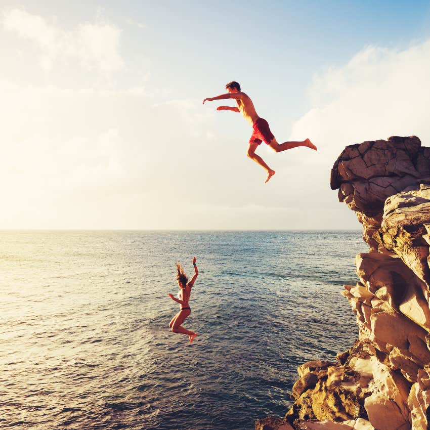 people taking risks by cliff-jumping