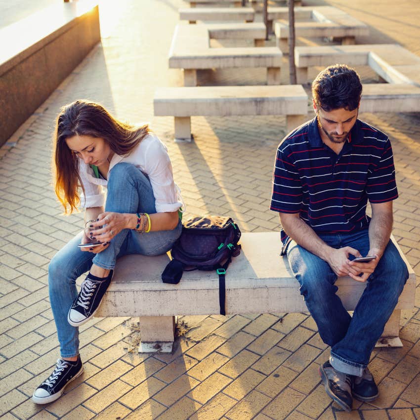 Couple separated on a bench because they aren't considering each other's side of the story