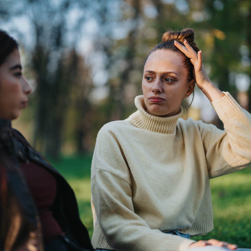 Entitled woman saying "What's in it for me?" to her serious friend. 