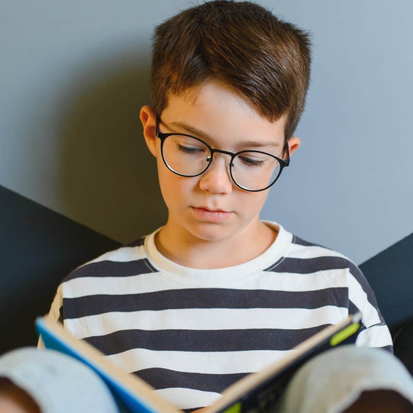 Gen X child being truly alone and reading a book at home