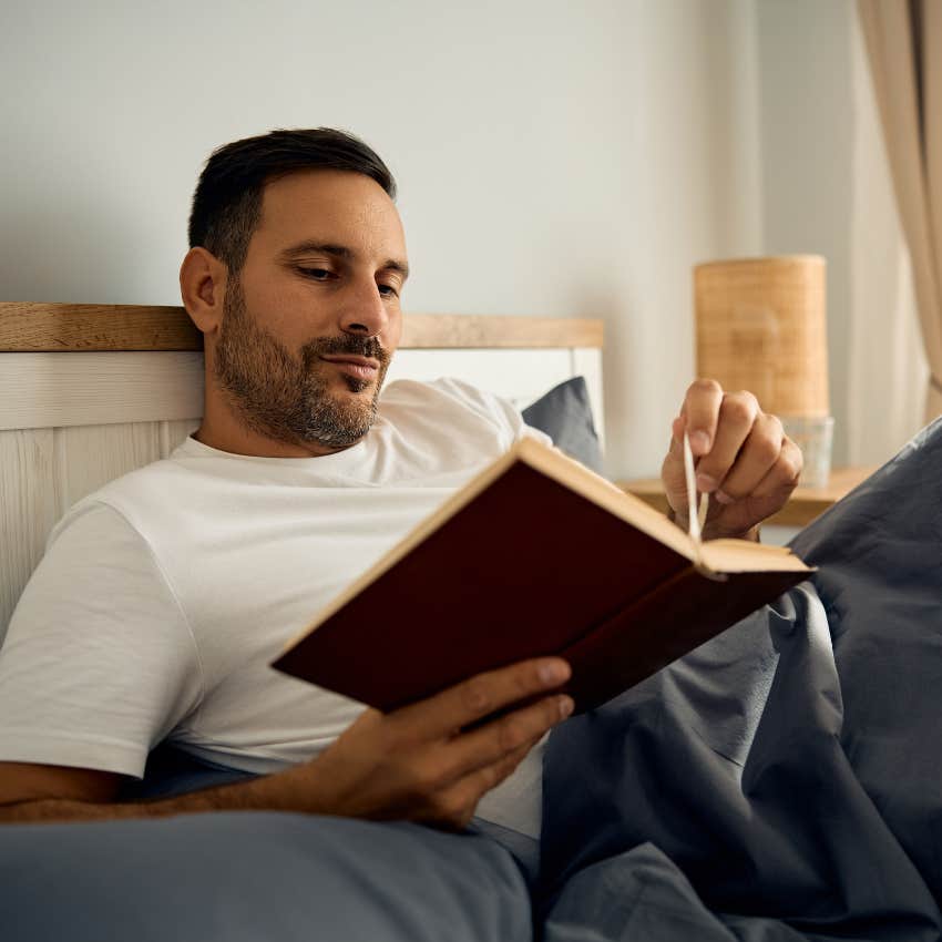 Man who does hard labor enjoying reading as a relaxing hobby