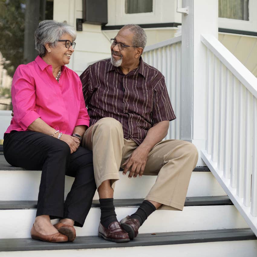 couple smiling after being raised to believe everything will be alright