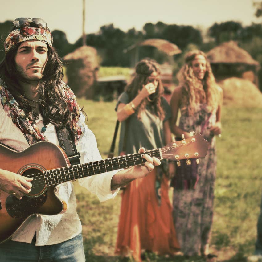 hippies gathering and playing guitar to protest vietnam