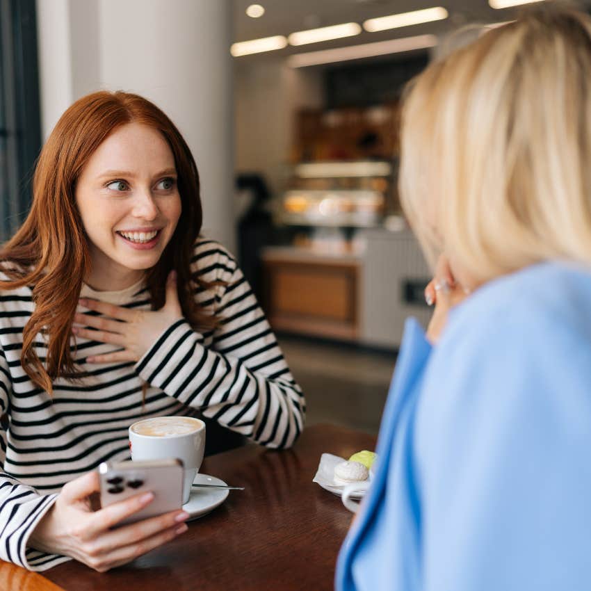 two young gen z women gossiping
