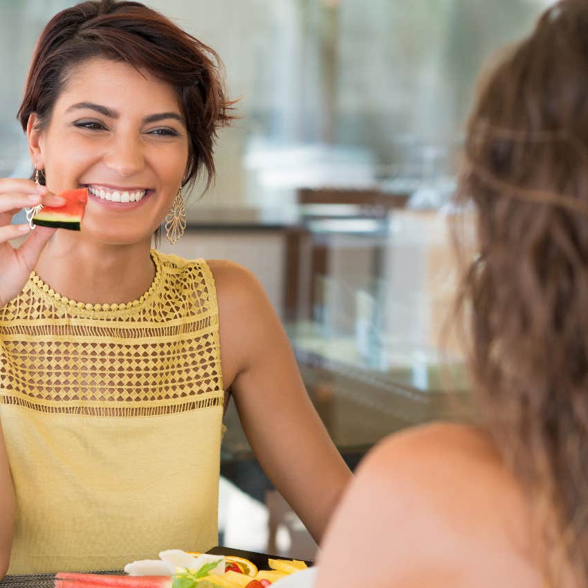 girl complimenting her skinny friend at lunch