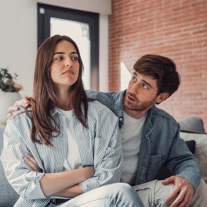 woman turning her back on her partner because of childhood abandonment issues