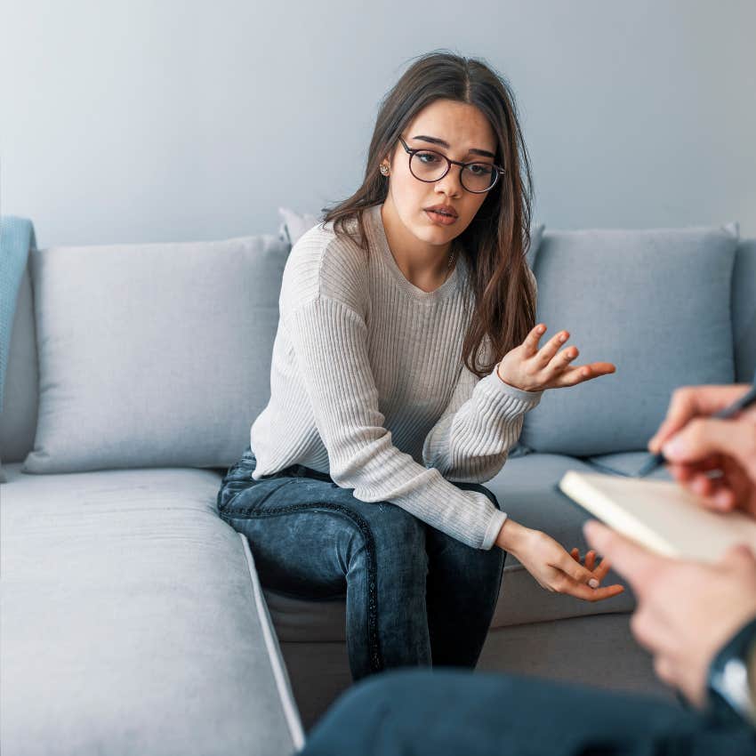 woman struggling to be vulnerable with therapist