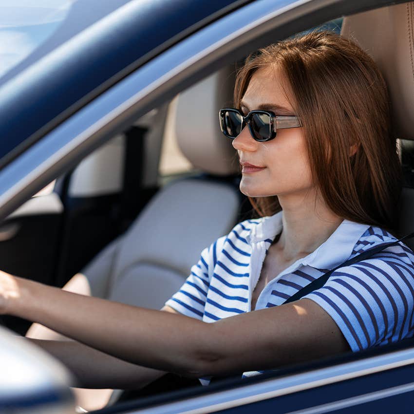 woman wearing sunglasses while driving