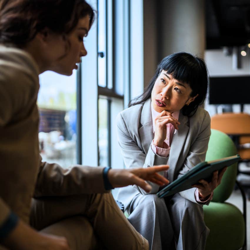 Gen X woman making direct eye contact with her co-worker