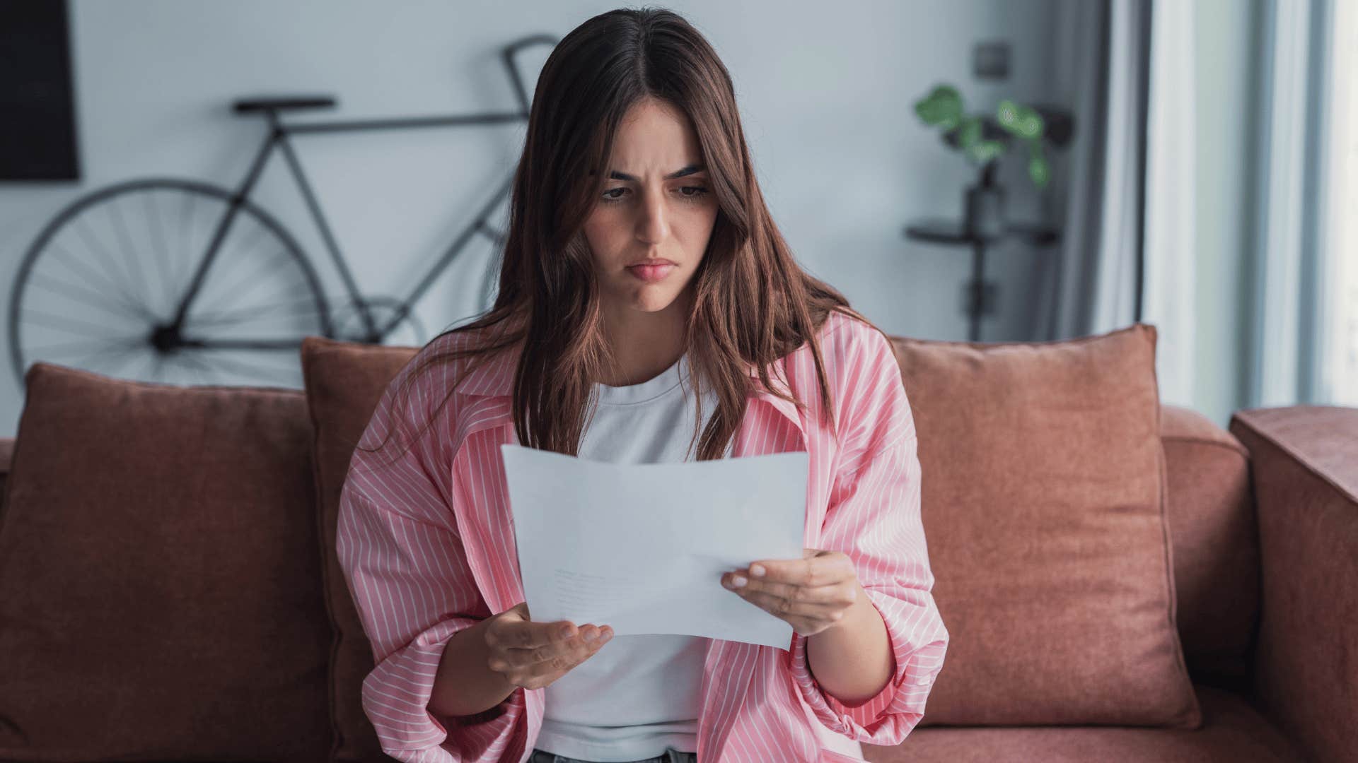 millennial woman looking at student loan payments