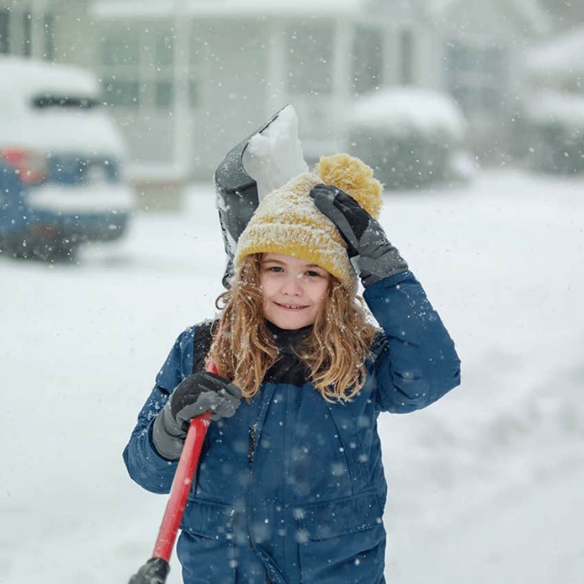 little girl with the boring chore of shoveling snow that will prep her for real life