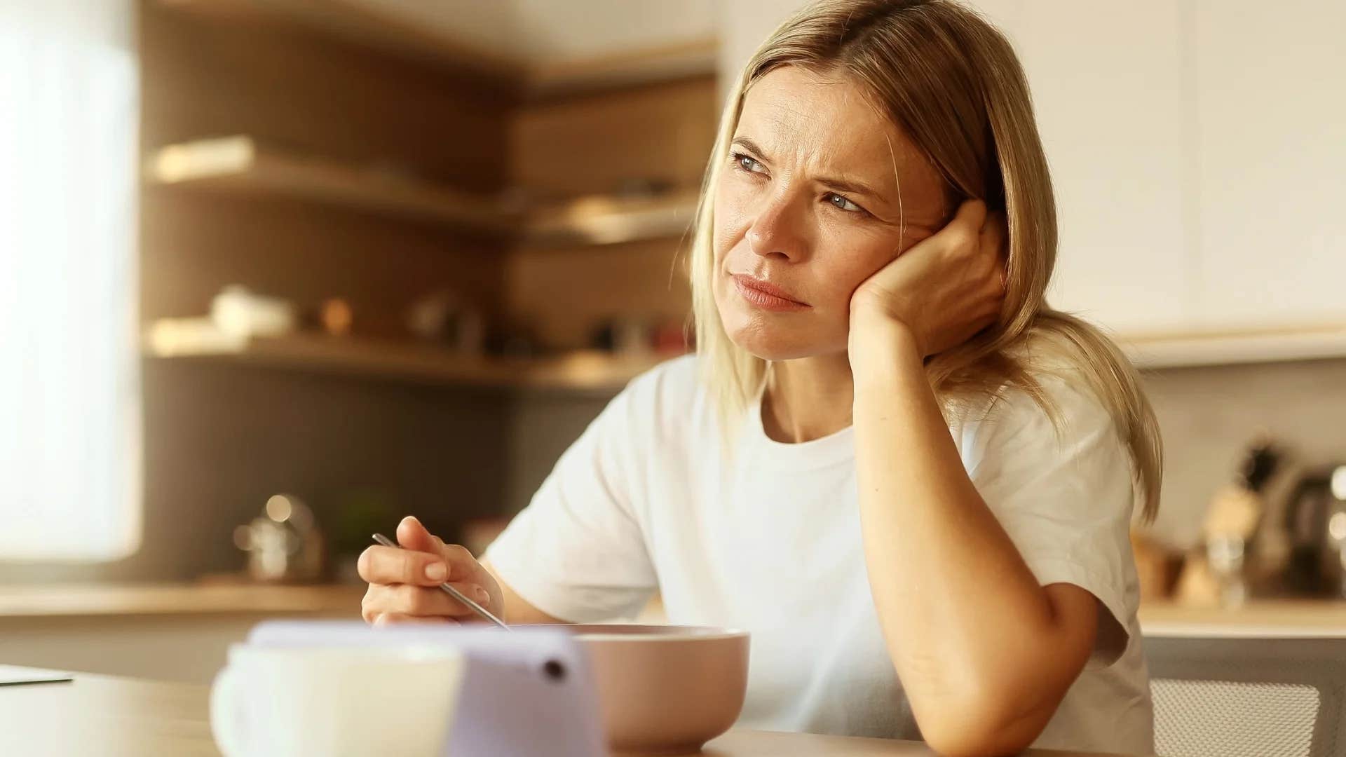 lonely woman sitting at home not feeling the need to fit in anywhere