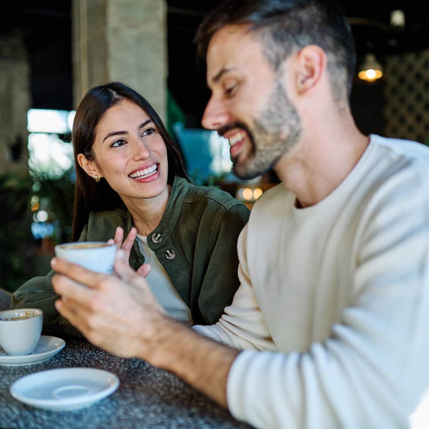 likable woman giving her friend her full attention over coffee and conversation