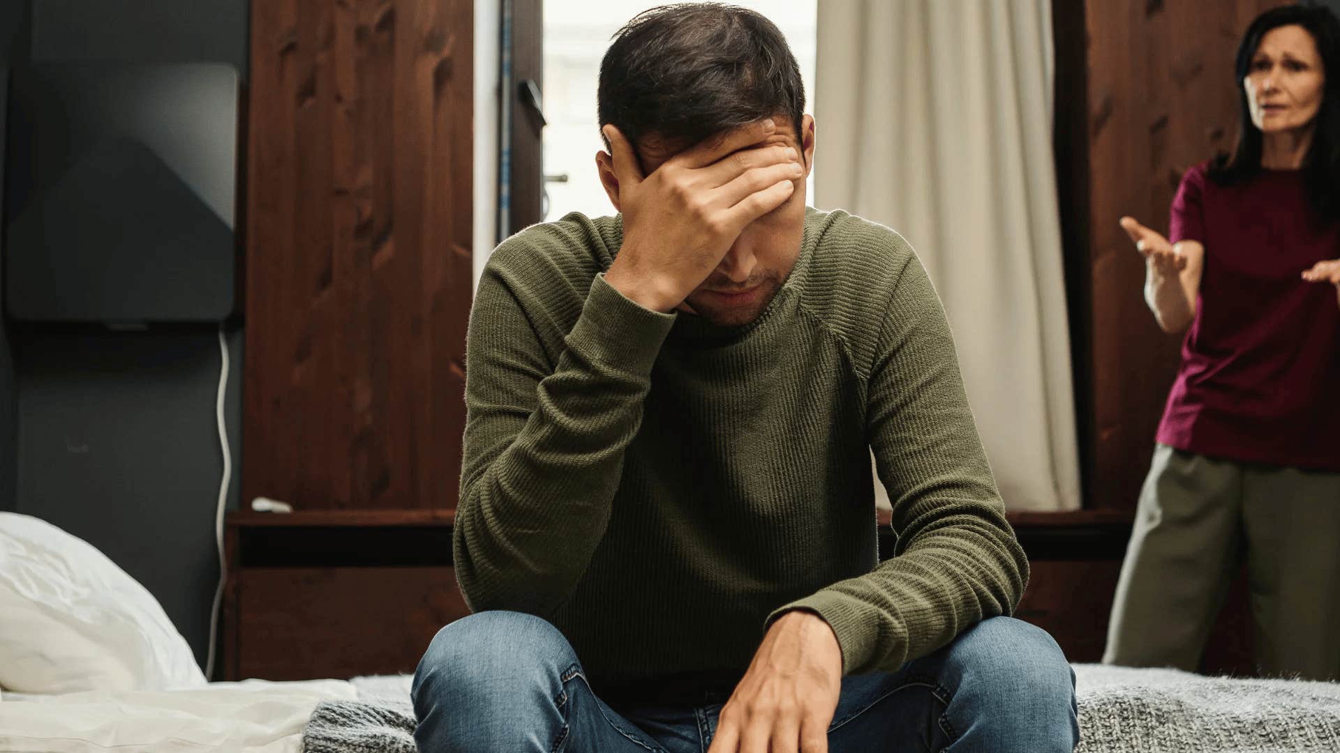 adult man upset his mom is minimizing his childhood trauma
