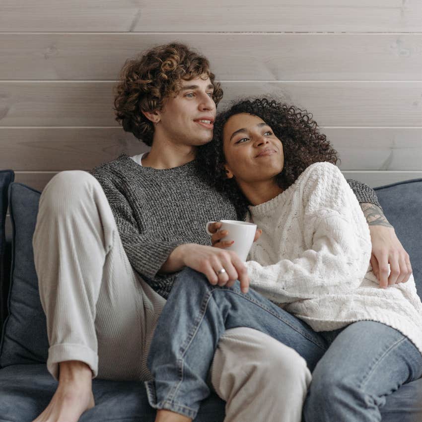 Couple relaxing comfortably together at home don't get annoyed with each other