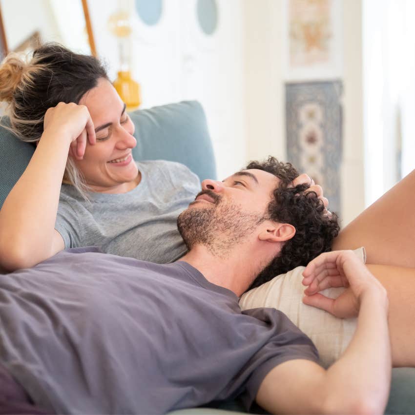 Couple laughing together after a minor disagreement instead of allowing a small irritation to ruin their time