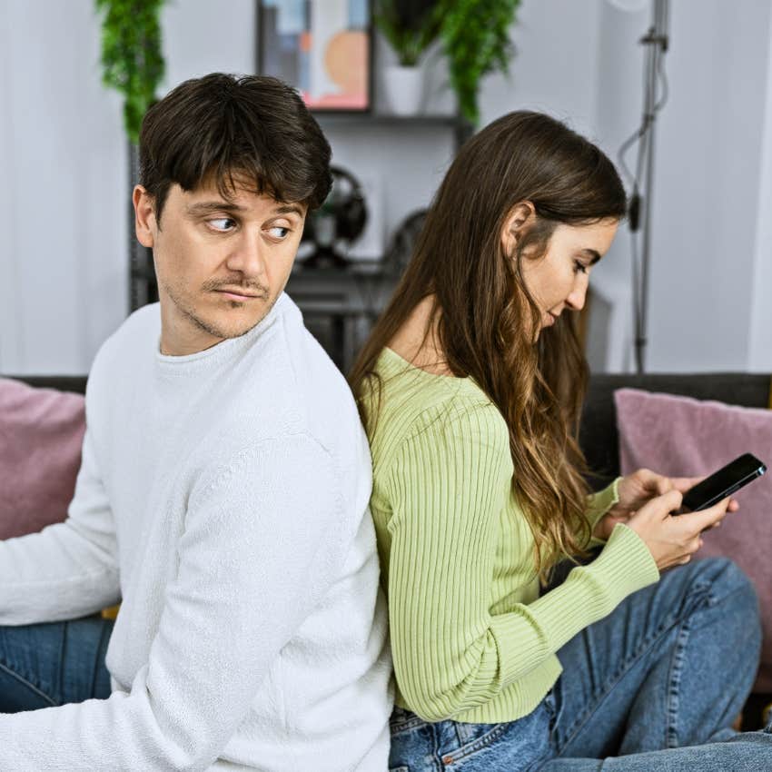 Couple using busyness as a distraction with their phones.