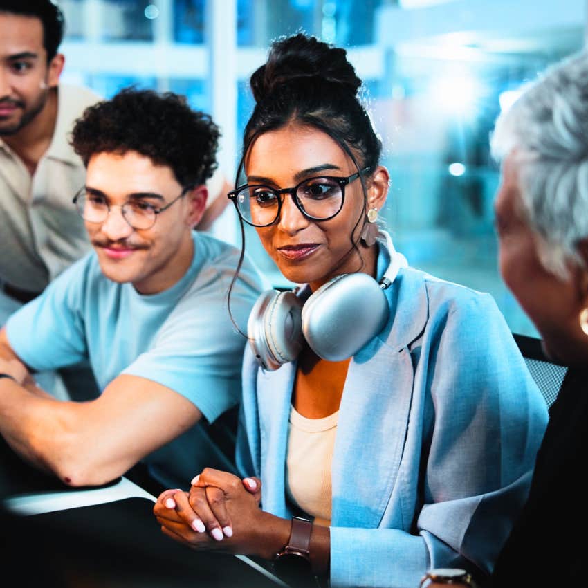 intelligent antisocial woman at work telling colleagues sorry, I was just thinking about something