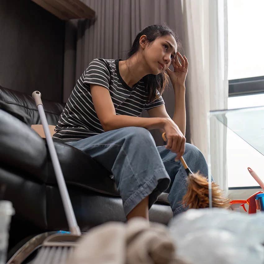 woman becoming emotional over the best way to clean after moving in with partner