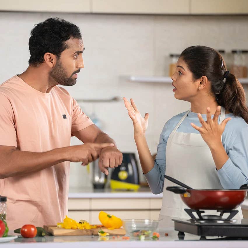 couple arguing over dinner after moving in together