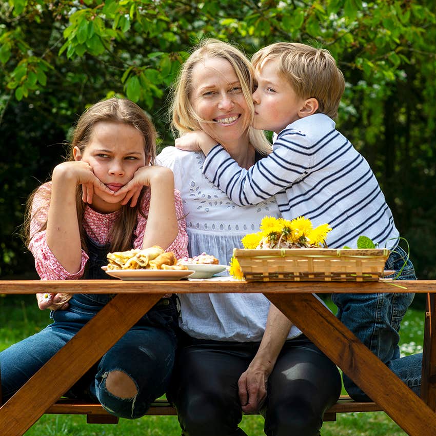 mother showing favoritism to one child over the other