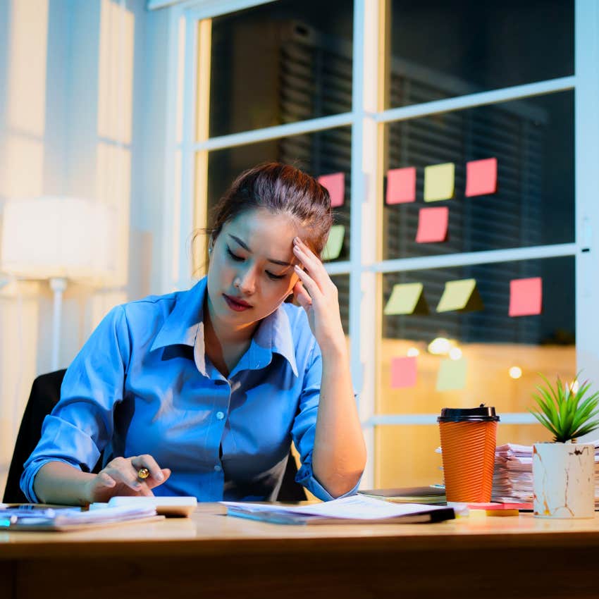 millennial woman working late thinking you have to earn flexibility