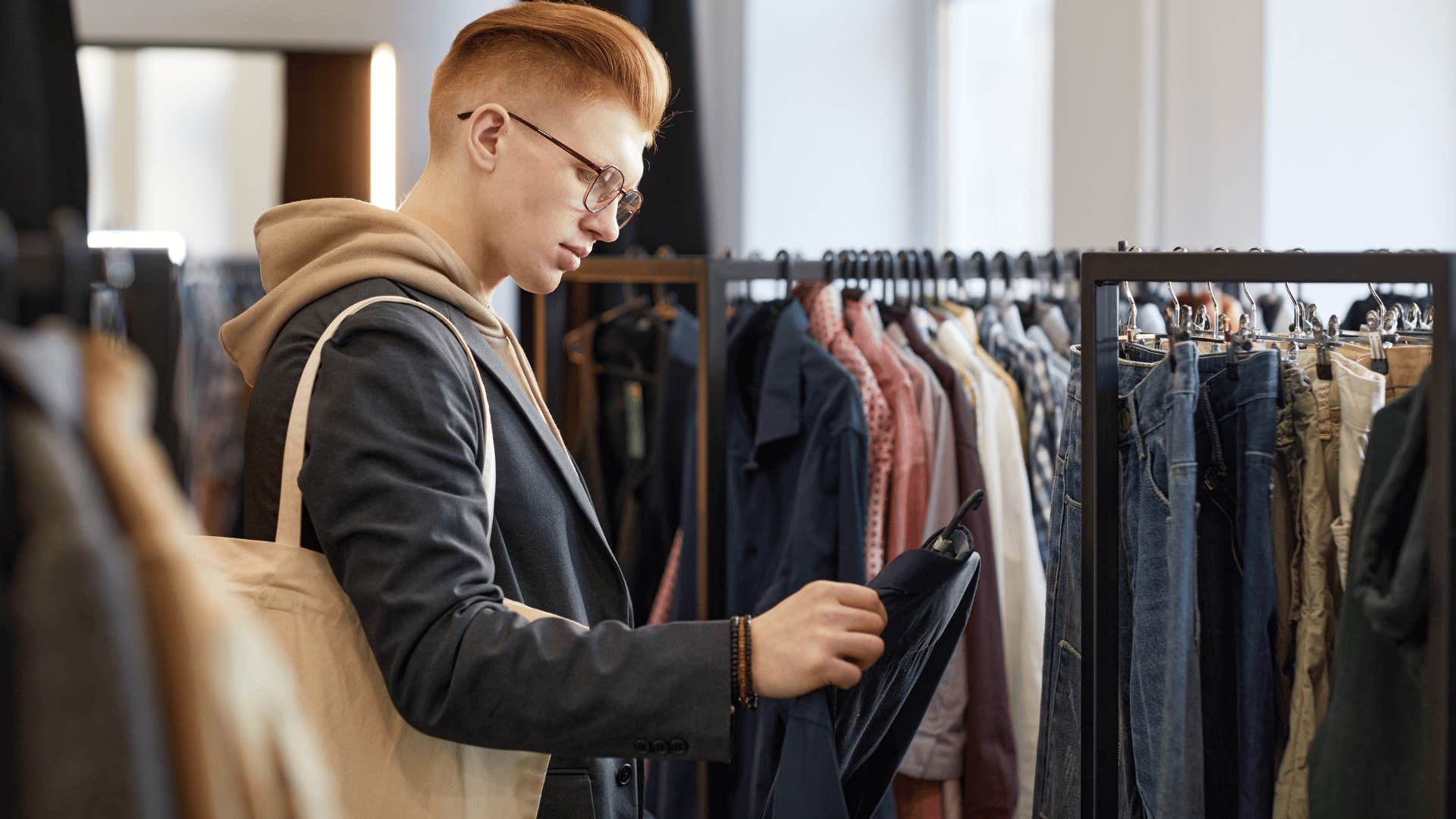 gen Zer seeing if clothing is sustainable at thrift store