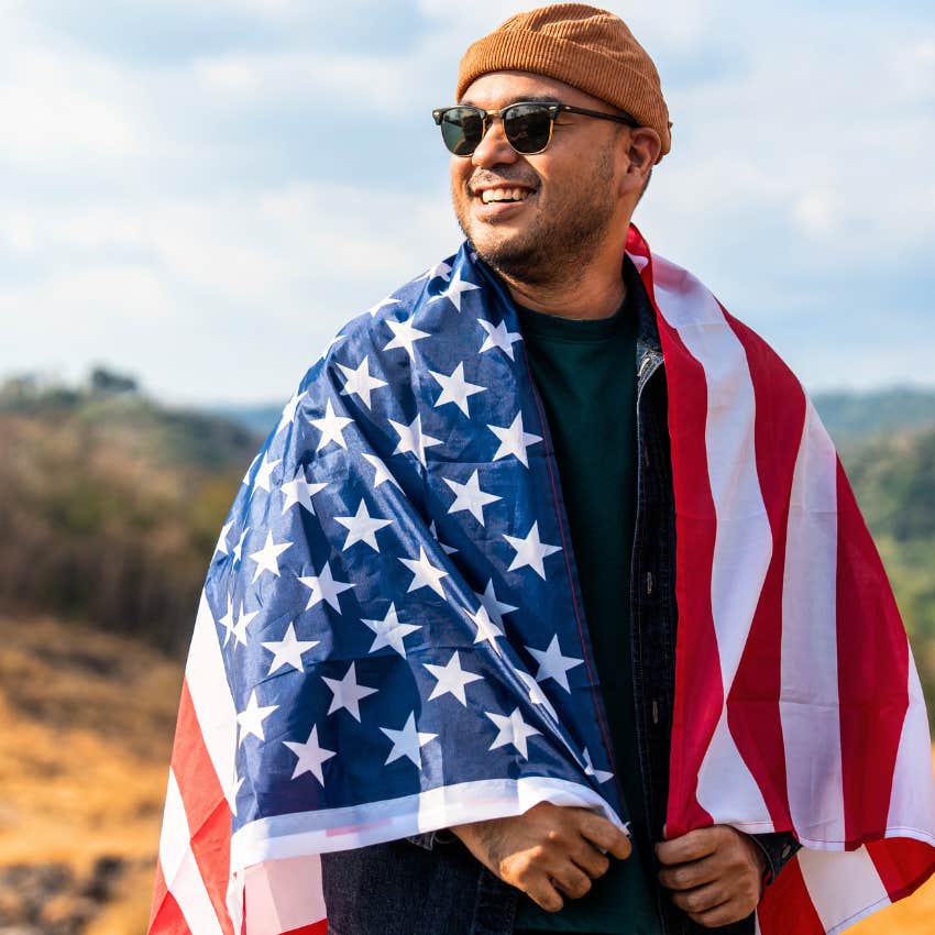 Patriotic man standing outside and smiling. 