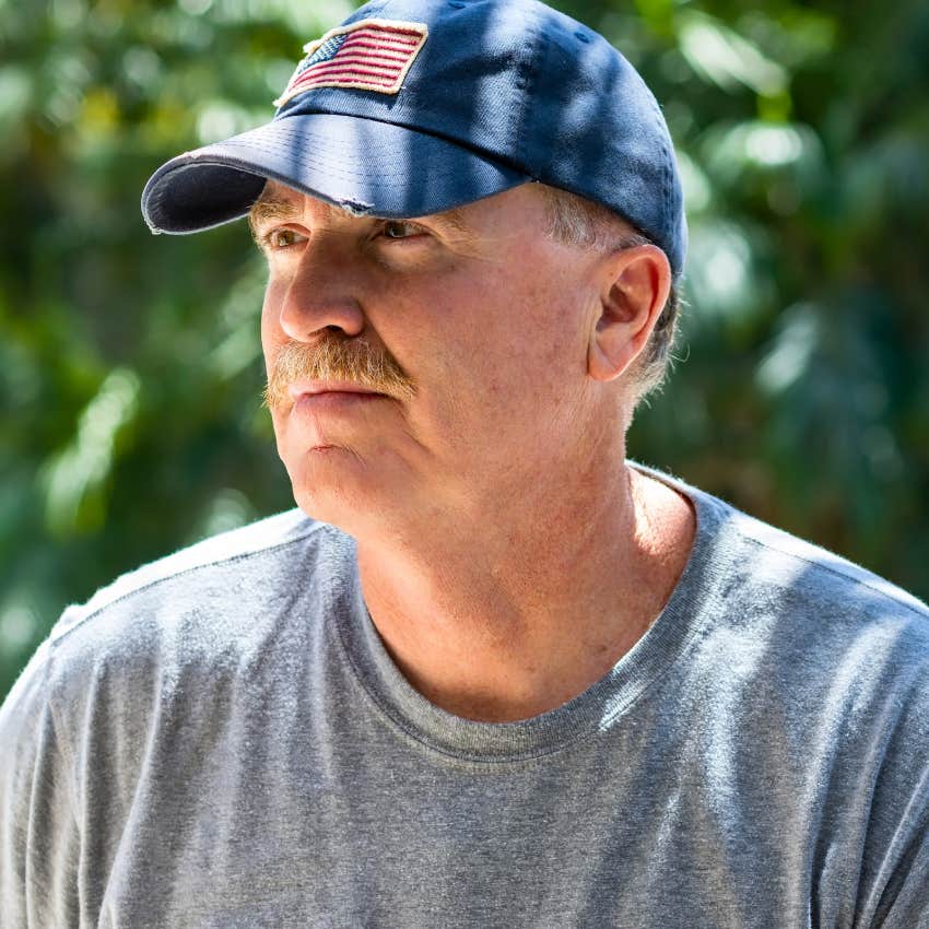 Man who values loyalty, work ethic, tradition, and respect sitting outside.