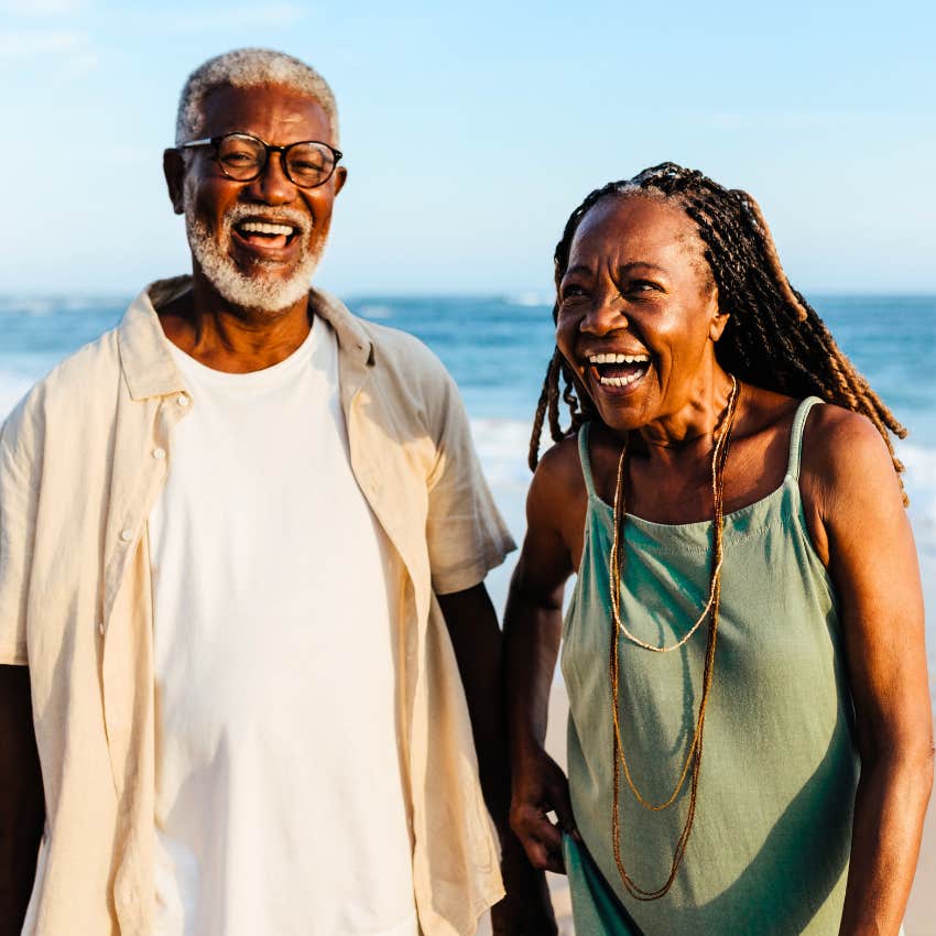 boomer couple vacationing on the beach for rest and tradition