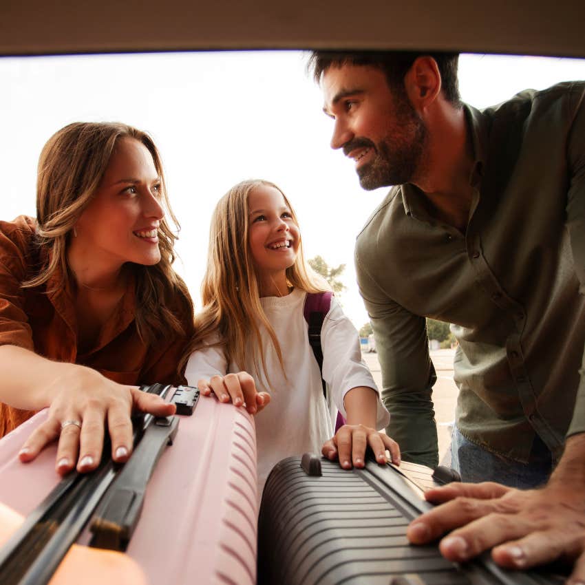 gen x parents and their child packing car for vacation