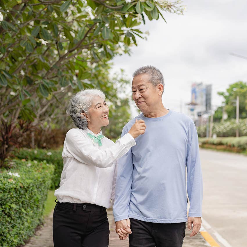 baby boomer couple taking a walk in the morning