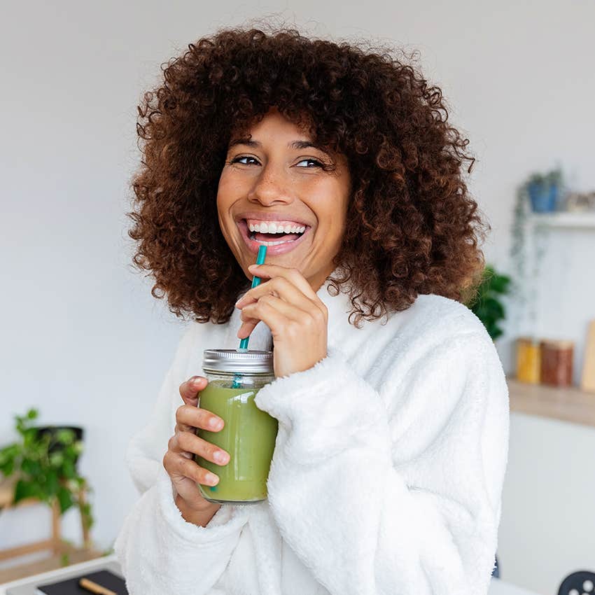 millennial woman drinking healthy smoothie in morning