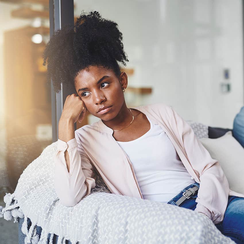 woman sitting alone feeling upset after an argument
