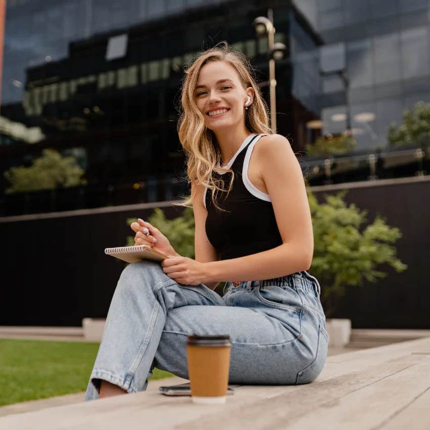 woman who has her life together carrying a notebook in case creativity strikes